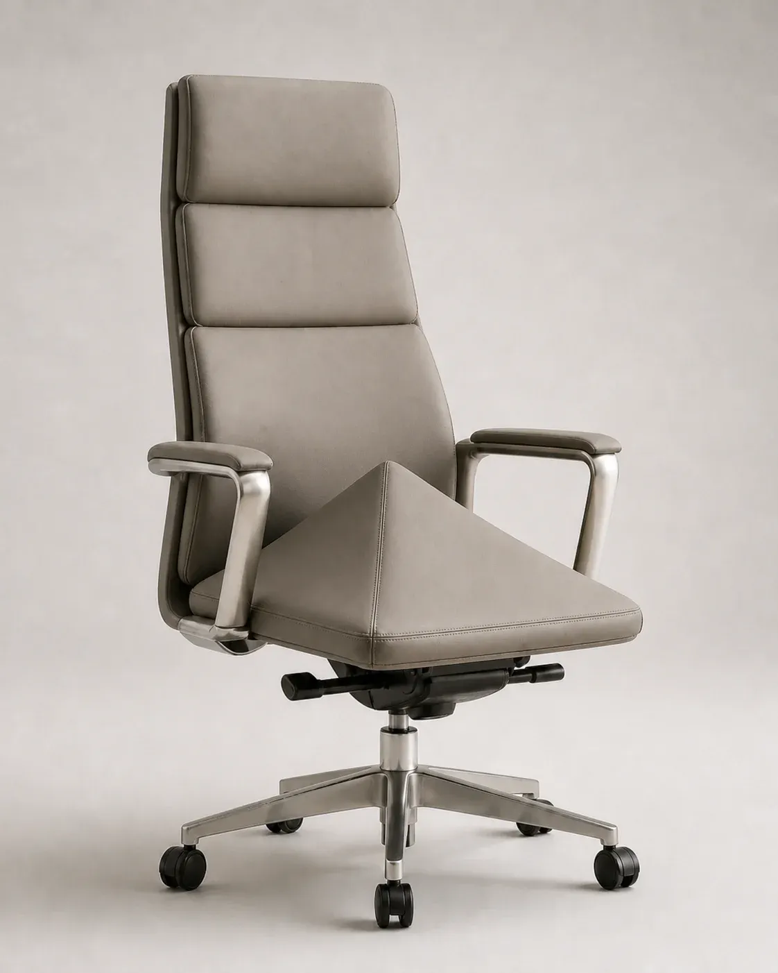 An executive office chair with a paper airplane folded into the seat