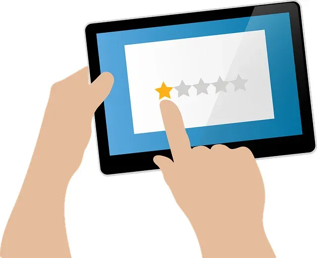 Flat illustration of two hands holding a tablet. On screen, a white panel shows five stars; the first is filled orange and the remaining four are grey, and an index finger is tapping the first star.
